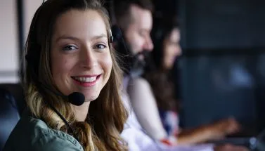 Customer support agent with headset – contact our team
