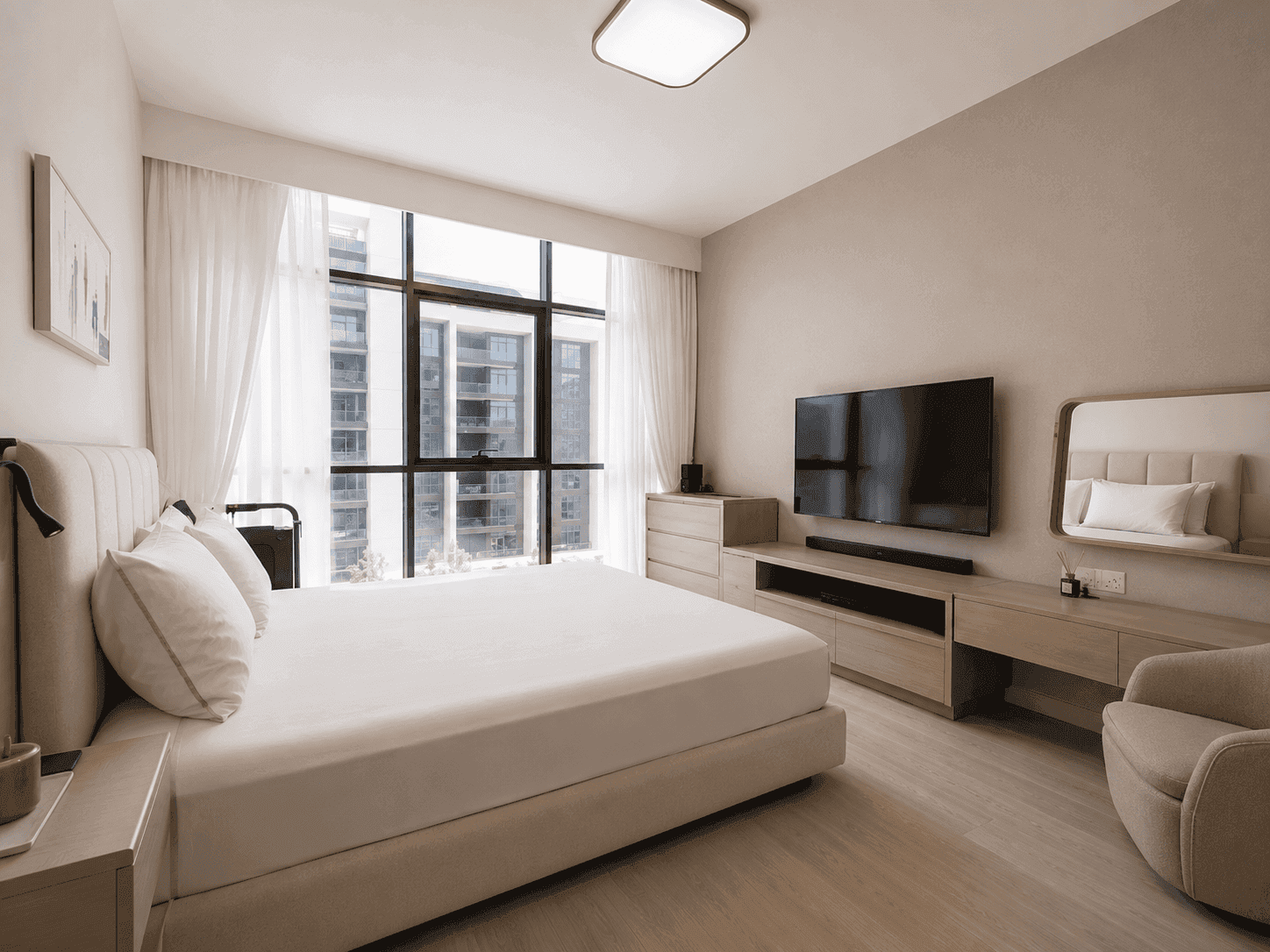 Master bedroom renovation with upholstered bed, wall-mounted TV and pale oak furniture in Dubai Hills Estate