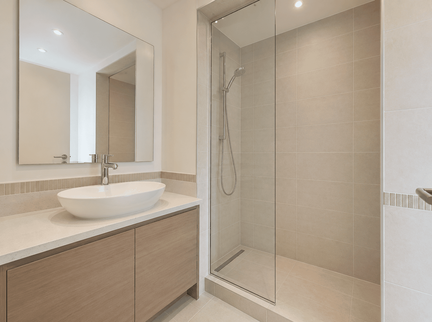 Bathroom renovation with walk-in shower, vessel basin and oak vanity in Victory Heights villa, Dubai