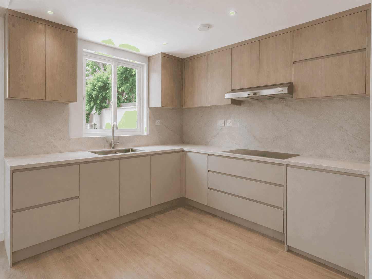 Villa kitchen renovation with oak and greige cabinets, marble-look splashback and garden window in The Lakes, Dubai