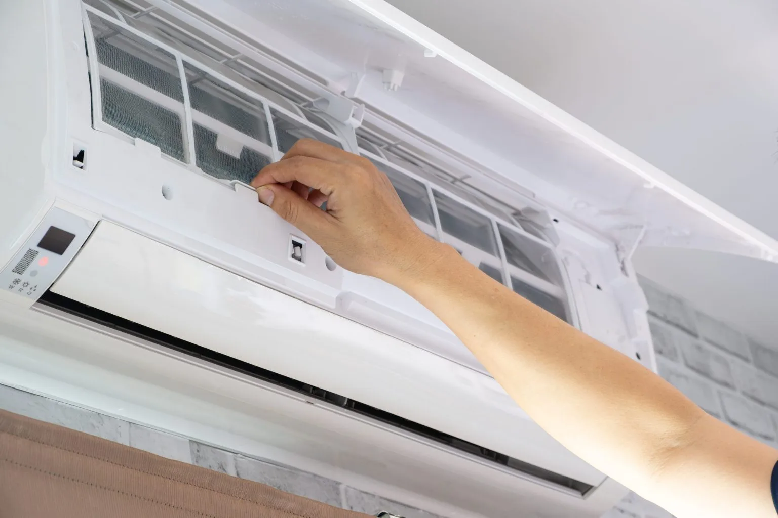 Split AC front panel opened to access the air filters during servicing in Dubai