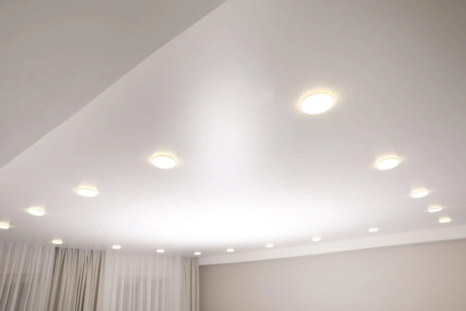 Floating gypsum ceiling with recessed and surface mounted LED lighting in a Dubai apartment