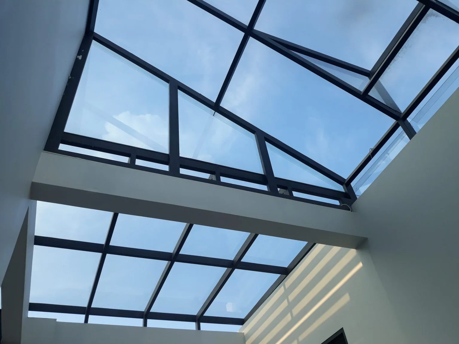 Framed glass roof skylight over a Dubai interior
