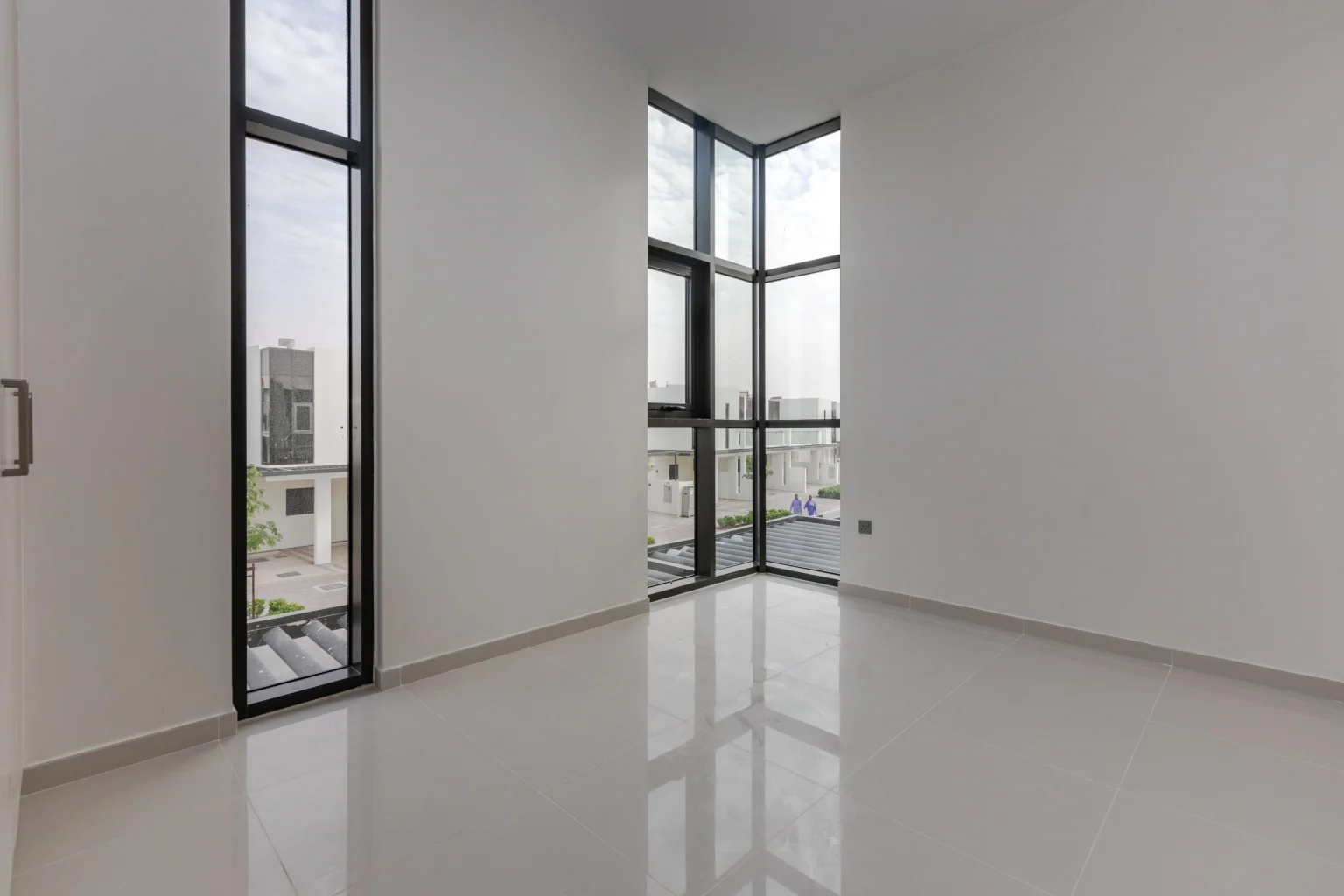 Black-framed corner glazing in an empty Dubai apartment