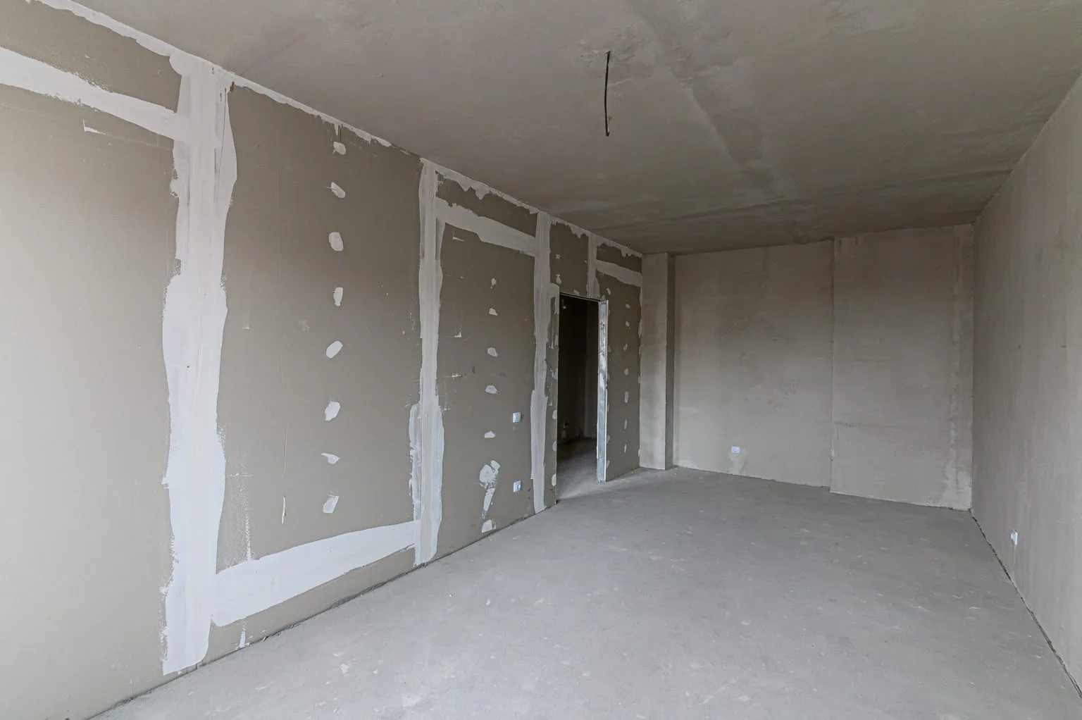 Gypsum partition walls boarded and taped in a bare Dubai apartment