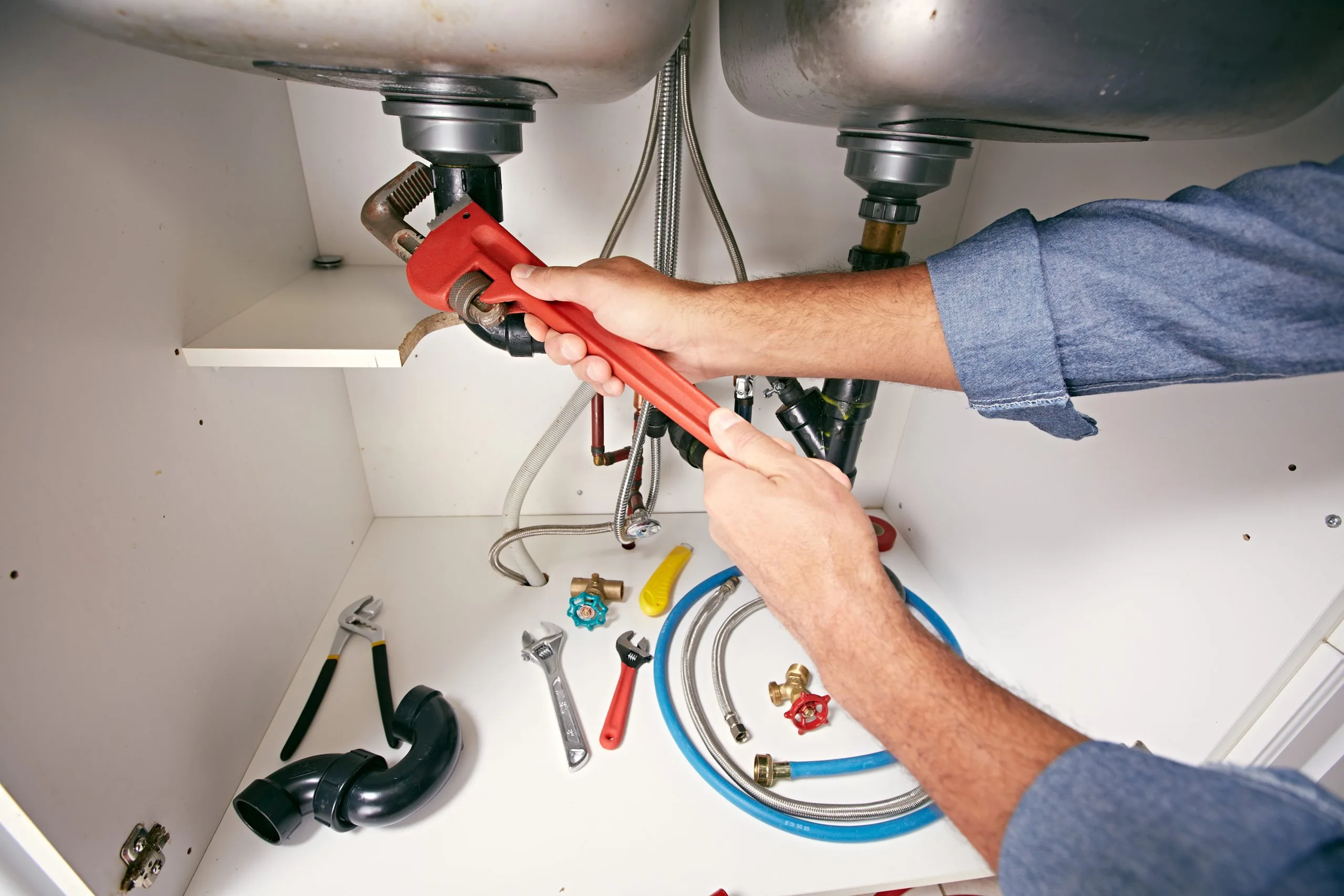 Kitchen plumbing works: sink and tap installation pressure-tested before cabinets go in, Dubai