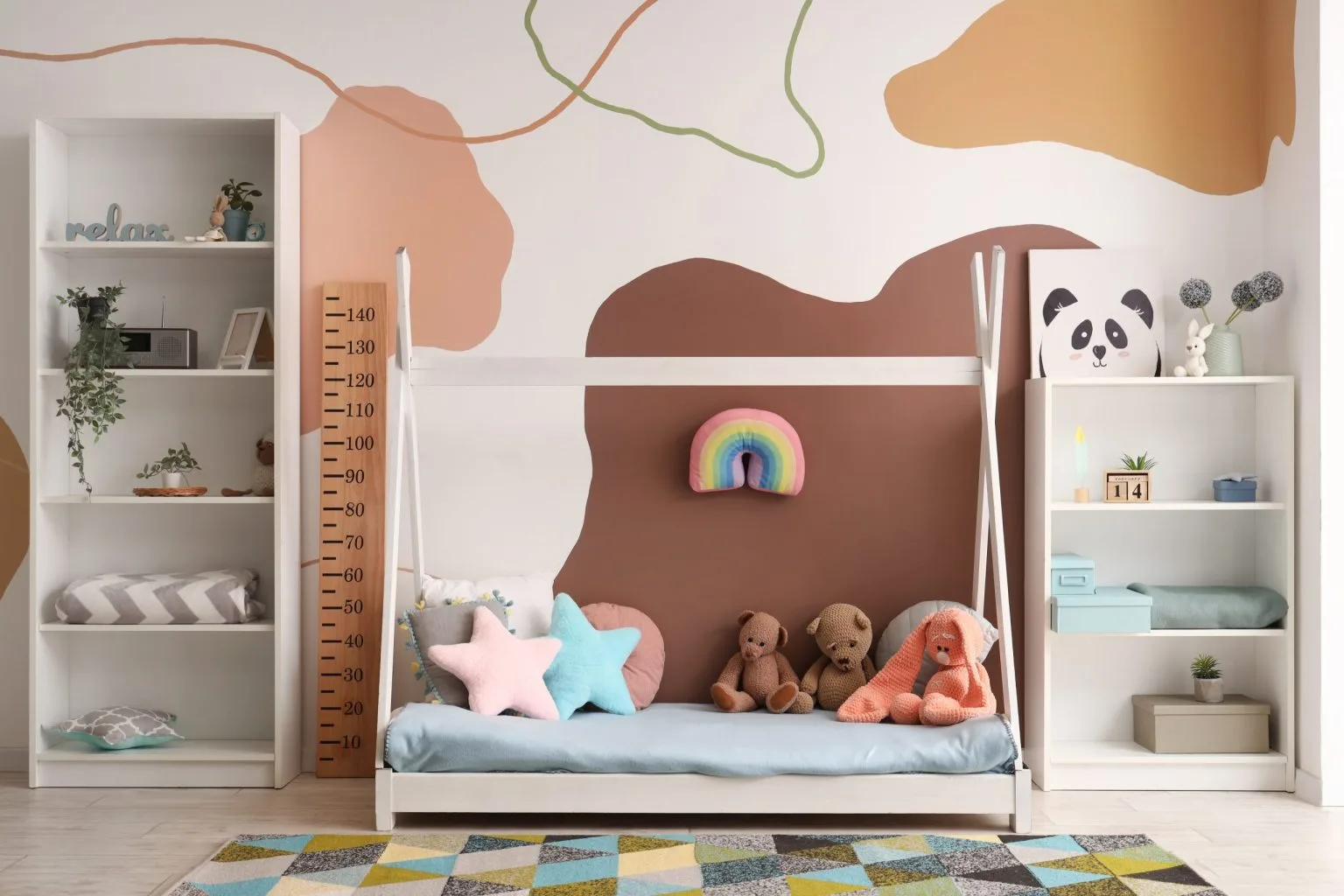 Children&rsquo;s room in Dubai finished with a hand-painted mural and soft pastel wall colours