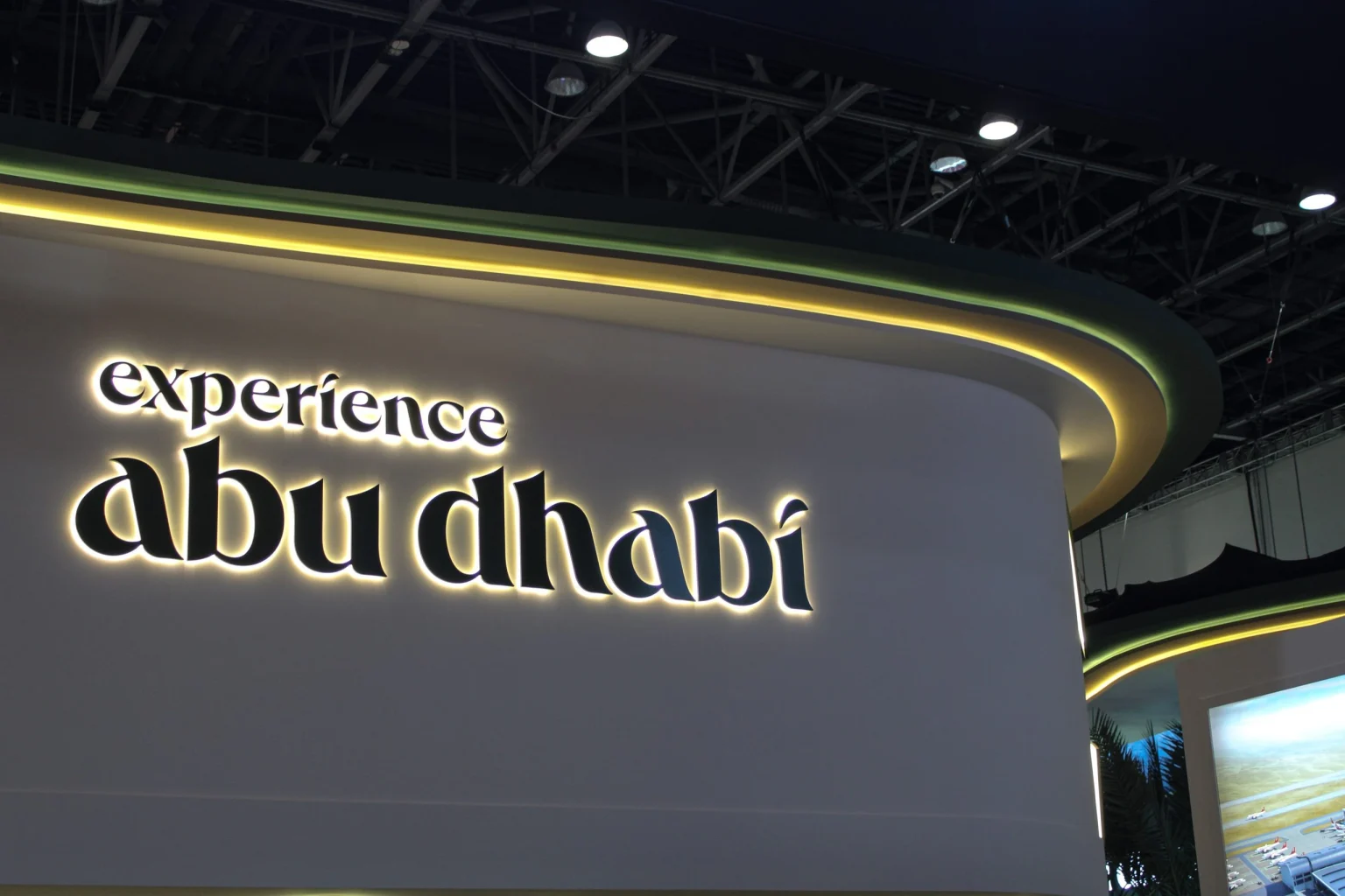 Halo-lit built-up letters glowing against a curved feature wall in a Dubai interior