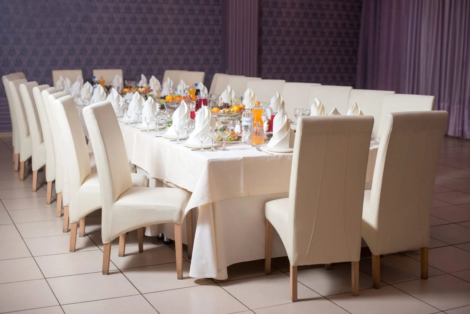 Rows of upholstered banquet chairs prepared for an event in a Dubai venue