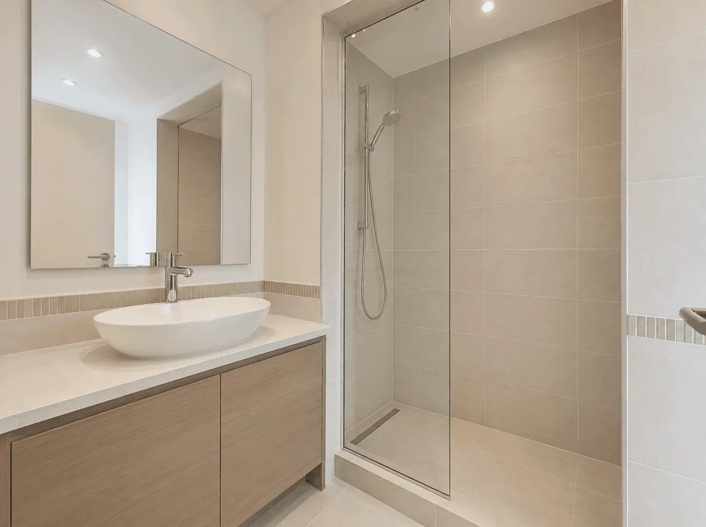 Bathroom renovation with walk-in shower, vessel basin and oak vanity in Victory Heights villa, Dubai