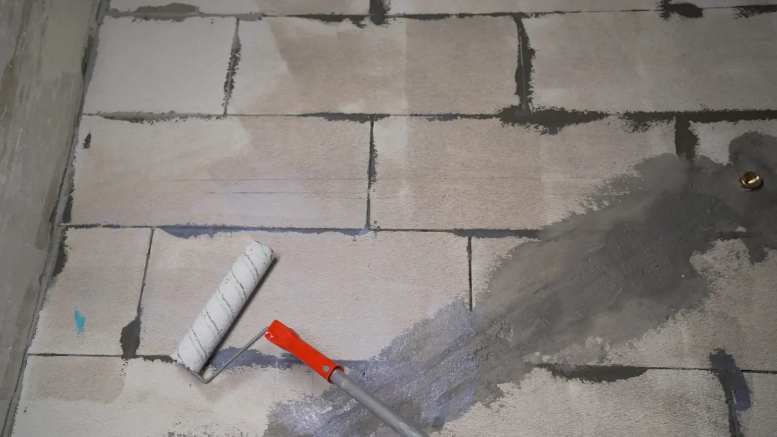 Waterproofing membrane applied to bathroom blockwork before tiling in a Dubai bathroom renovation