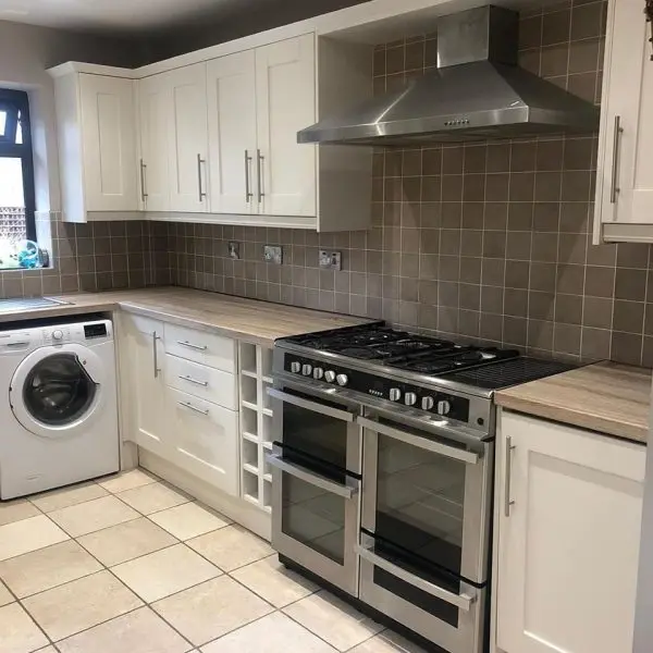 Bright white shaker kitchen after renovation by Fitout Renovation Dubai