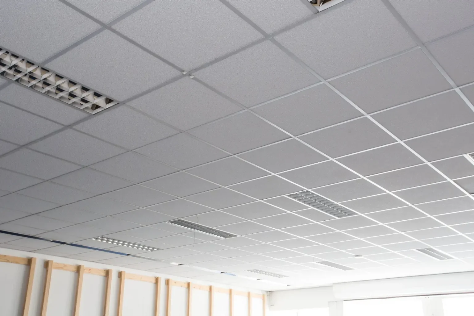 Suspended T bar mineral fibre grid ceiling installed in a Dubai office