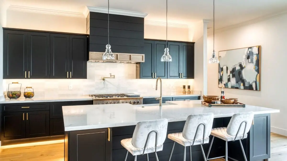Contemporary black and white kitchen after renovation by Fitout Renovation Dubai