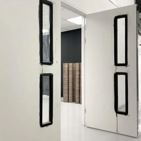 Door with black vision panels before installation
