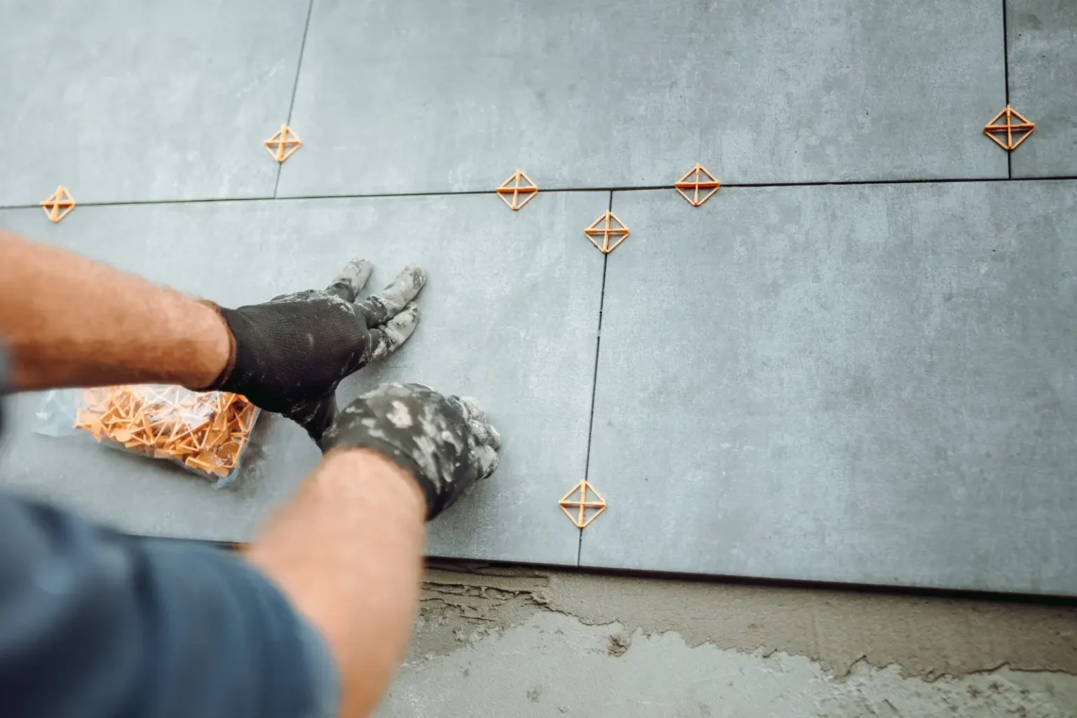 Large format porcelain tile flooring being installed in Dubai