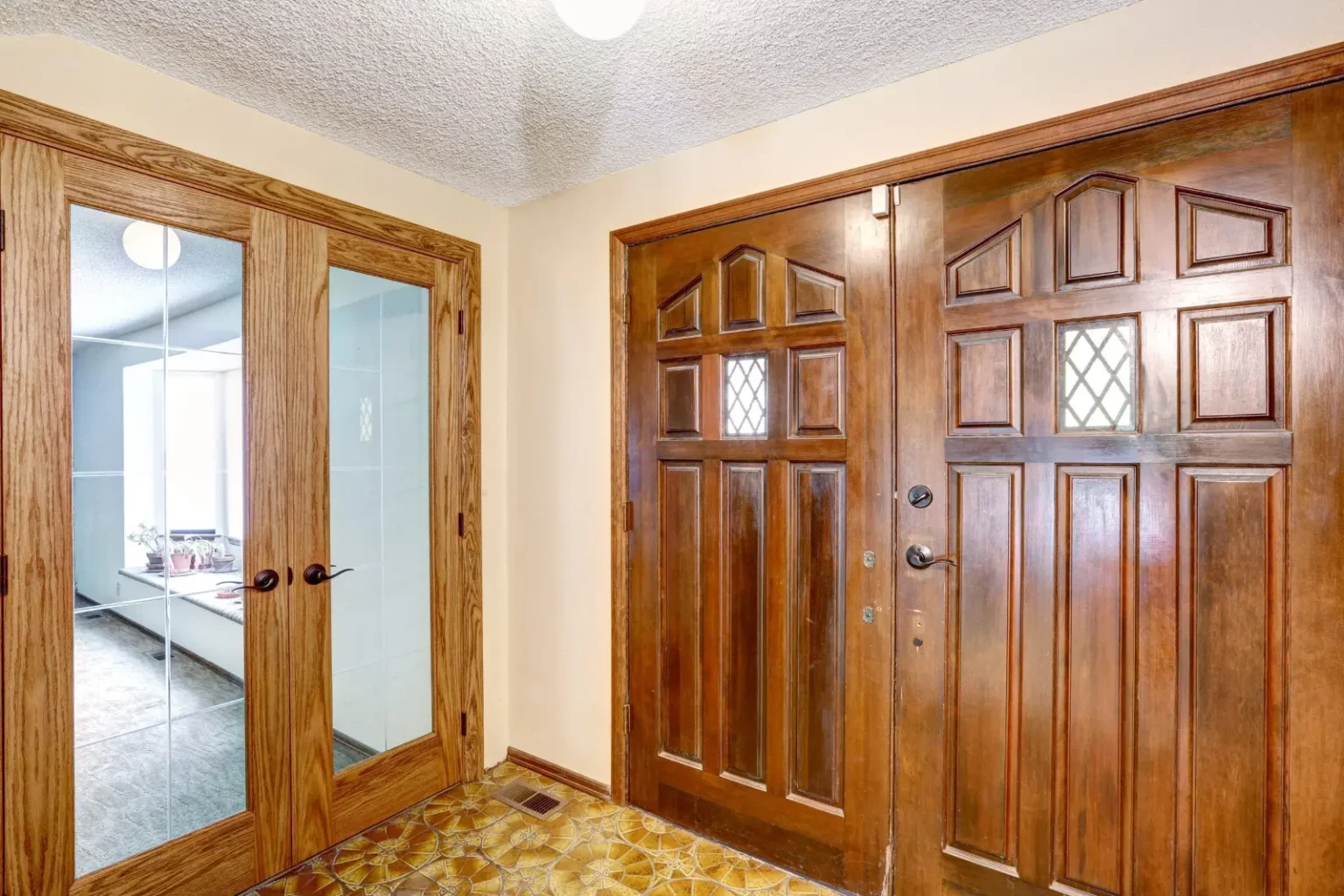 Solid wood panelled entrance doors with matching frames made by a joinery company in Dubai