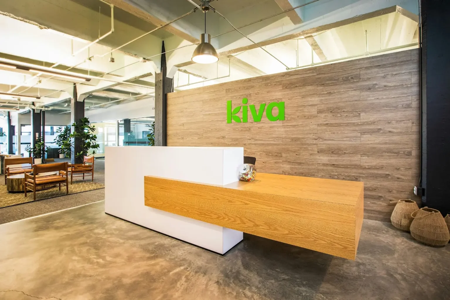 Custom office reception desk and timber feature wall installed by joinery contractors in Dubai