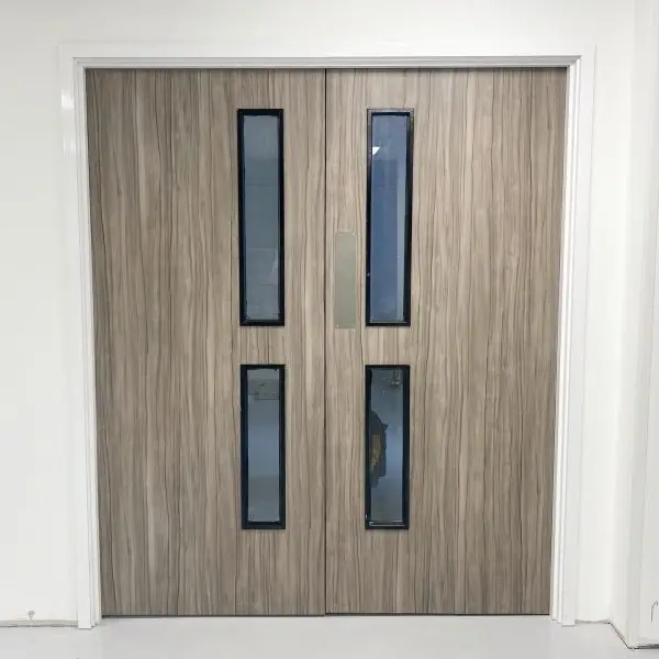 Modern double door with vision panels after installation by Fitout Renovation Dubai